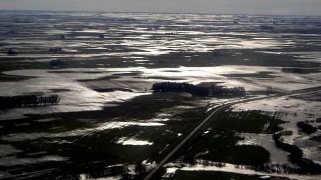 con los campos llenos de agua, federacion agraria exige una respuesta de scioli