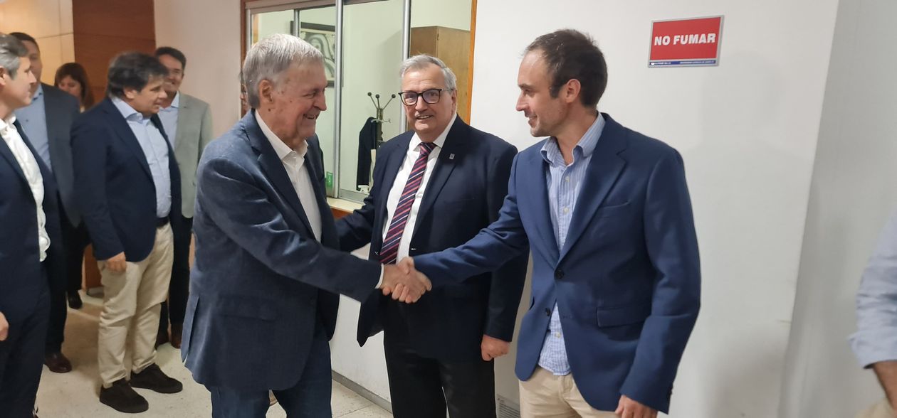 El presidente del PS de Entre Ríos, Juan Rossi, junto a Juan Schiaretti en una actividad.