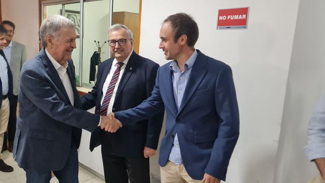 El presidente del PS de Entre Ríos, Juan Rossi, junto a Juan Schiaretti en una actividad.