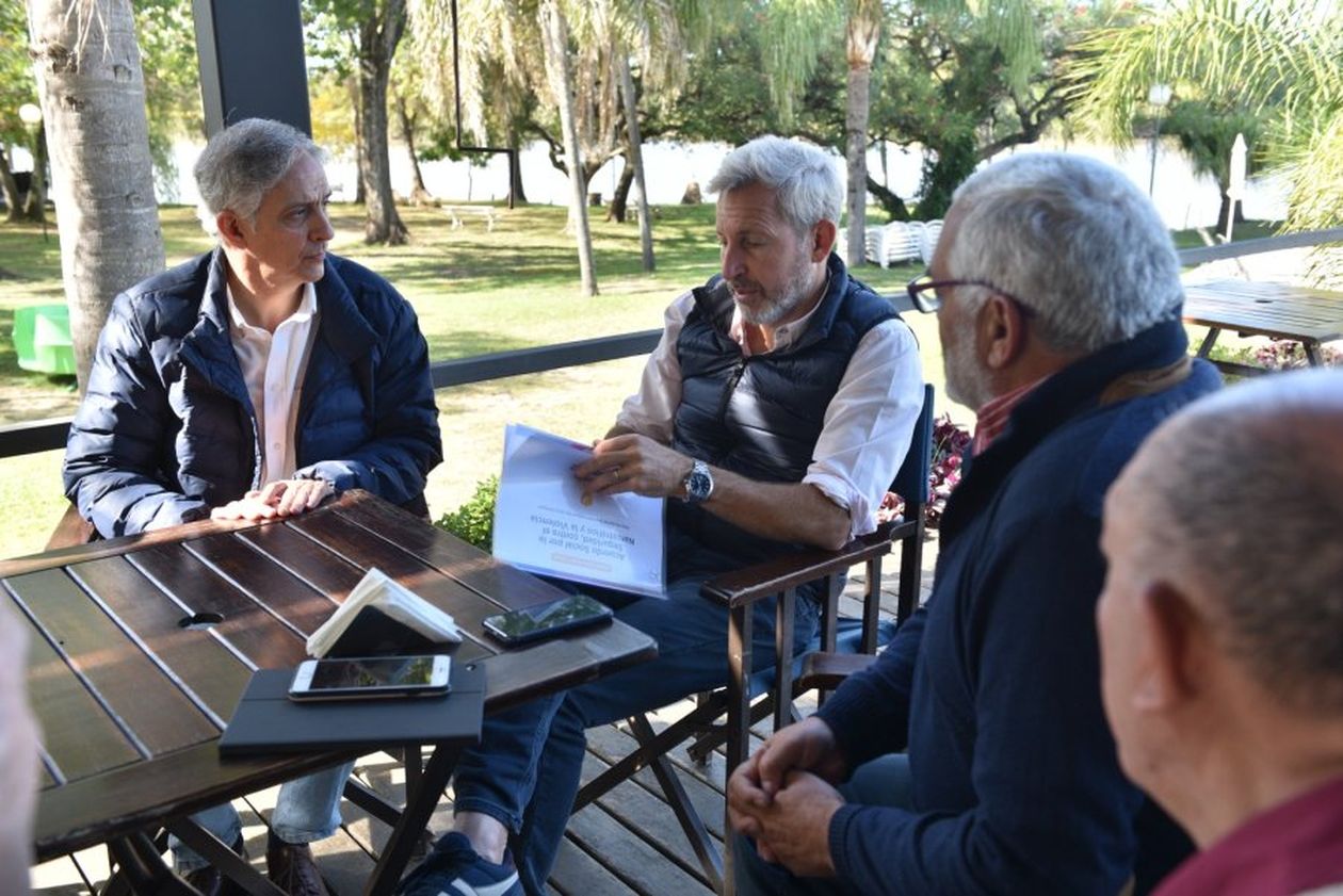 Osvaldo Fernández y Rogelio Frigerio.