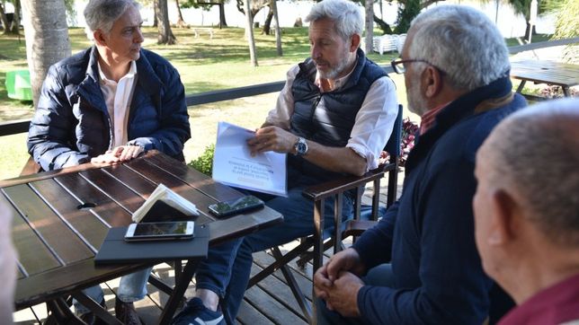 Osvaldo Fernández y Rogelio Frigerio.