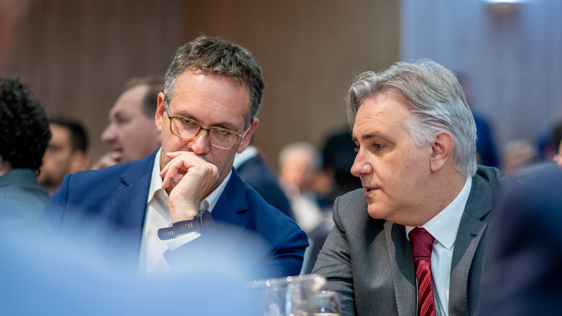 Martín Llaryora y Guido Sandleris. 